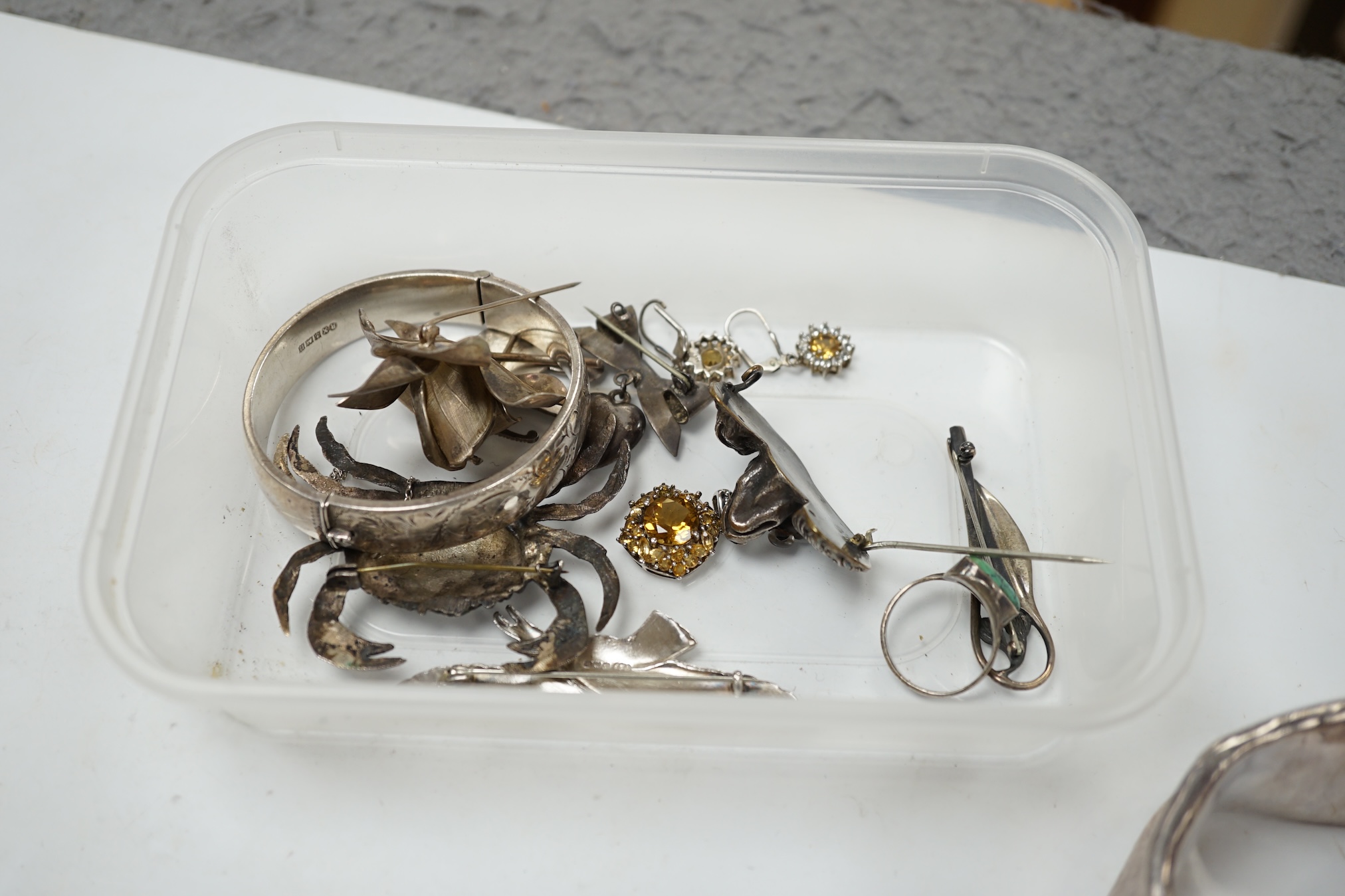 A small group of assorted silver and white metal jewellery, including bangles, brooches, etc. Condition - poor to fair